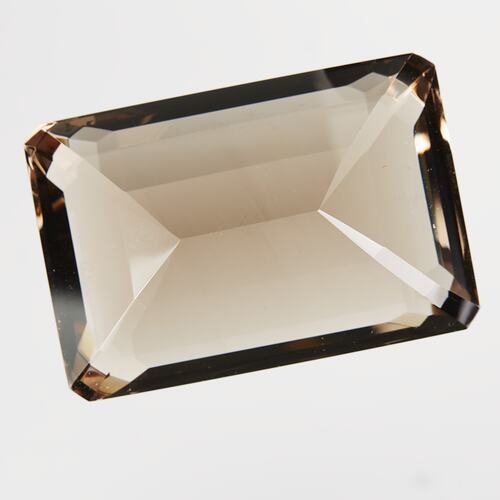 Rectangular, brown cut gem.