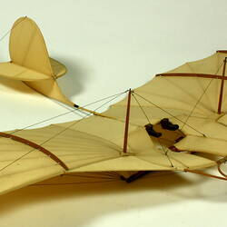 Model of off-white glider. Three quarter front right view.