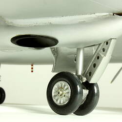 Silver model aeroplane. Landing gear and wheel detail.