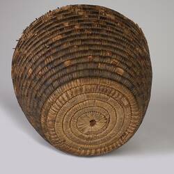 Woven fibre round basket, base view.
