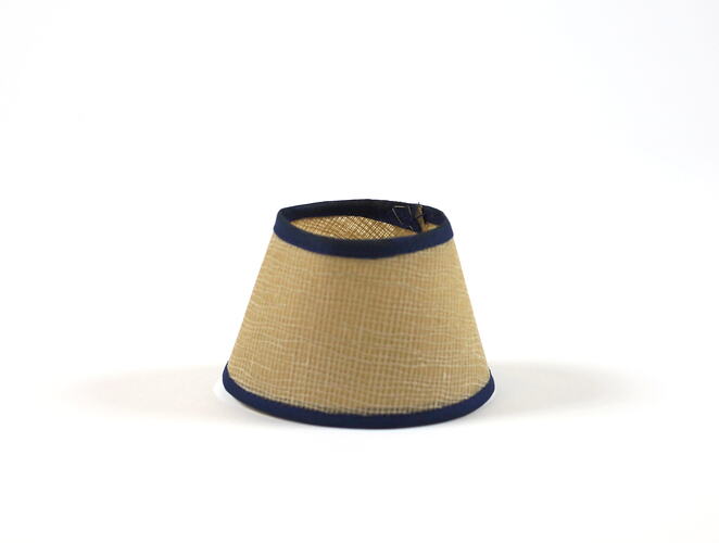 Cream toy lampshade, blue trim.