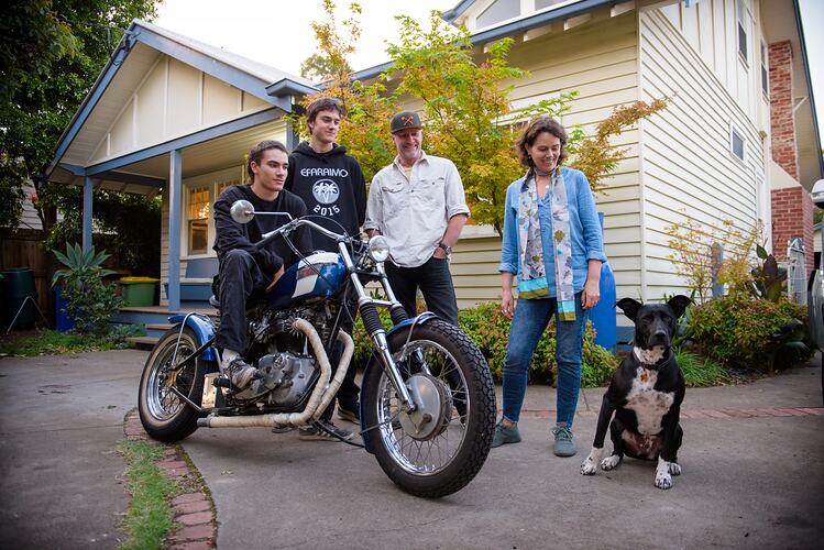 Family pose at home with a motorbike during COVID-19 lockdowns, Fairfield, Victoria, date TBC