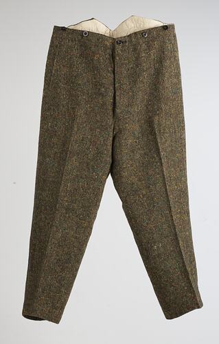Brown trousers with three buttons at waistline. Front view.
