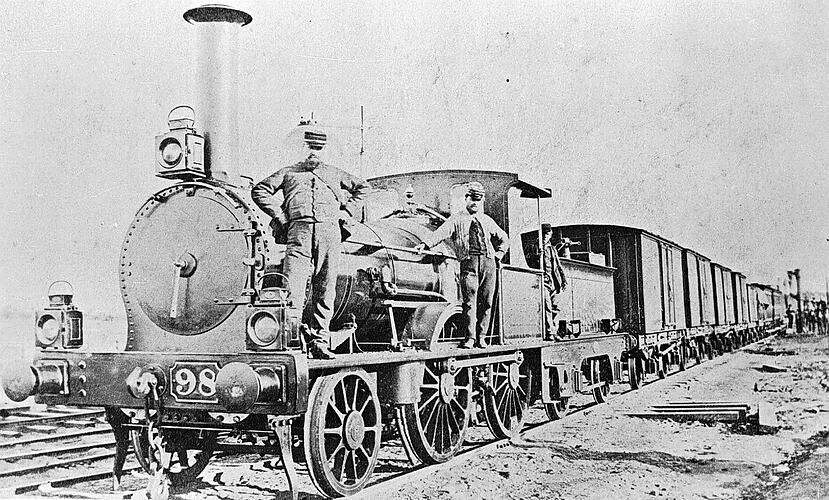 [Staff with F-class steam locomotive, circa 1875.]