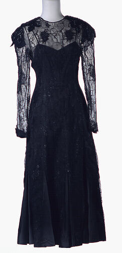 Long sleeved black cobweb lace dress, imitation beading.