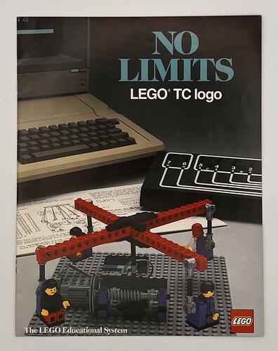 Front cover with red LEGO carousel build at front with four figures. Computer behind. Text above.