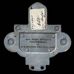 Back of metal car badge.
