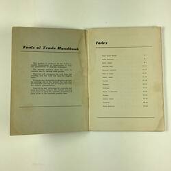 Open booklet, white with black printing.