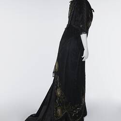 Black, silk satin dress, beading, floral embroidery. Back view.