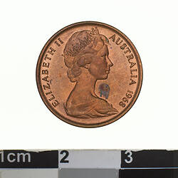 Round bronze coin featuring a crowned head of Elizabeth II facing right, text around.