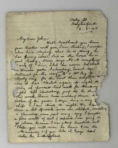 Handwritten letter on buff coloured paper, some of the page missing from insect damage. Cursive script in blac