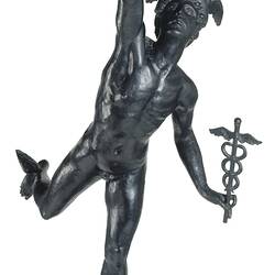 Metal statue of figure standing on an orb carrying a lamp and caduceus. Front view.