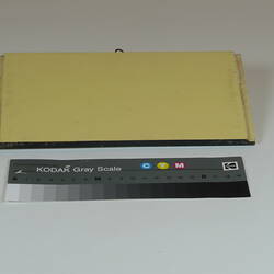 Painted board showing sample of colour yellow.