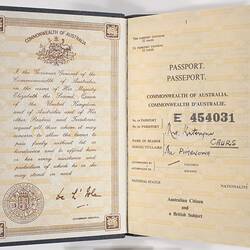 Open passport with off-white pages. Printed text and handwriting.