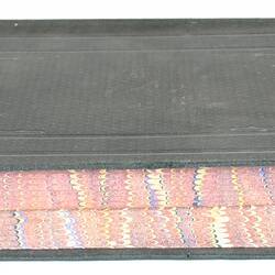 Black cloth-bound secret box book with marbled page-edges.