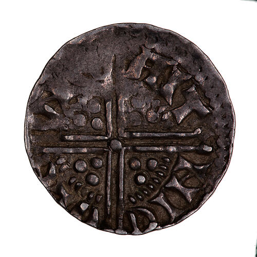 Coin, round, long cross voided which breaks through a beaded circle, a quatrefoil in each angle.