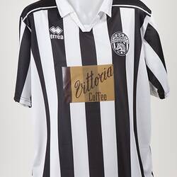Black and white striped soccer jersey.