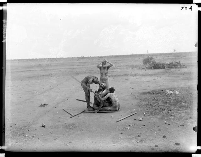 Women challenging one another to fight and cut their heads during mourning ceremonies, Tennant Creek, Central Australia, 16-17 August 1901