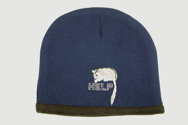 Blue knitted HELP beanie with black polar-fleece lining