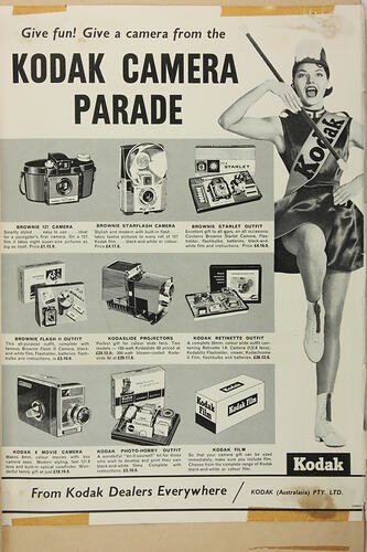 Advertisement for Kodak cameras with a marching girl.