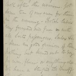 Open diary with handwritten text on discoloured worn page.