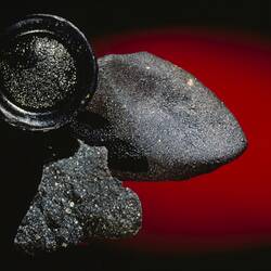 Meteorite and tektite specimens.