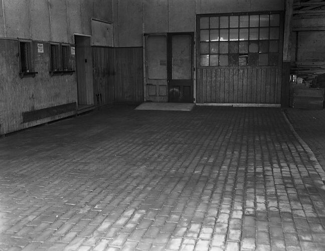 Monochrome photograph of a floor.