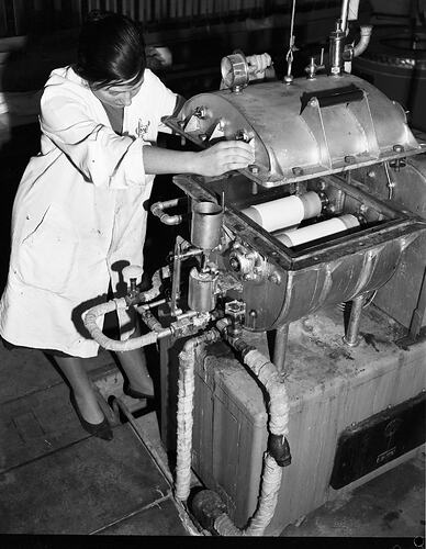 Monochrome photograph of a hoisery factory.