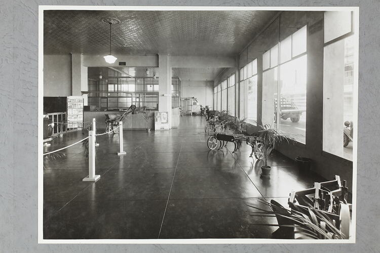 Monochrome photograph of a showroom interior.