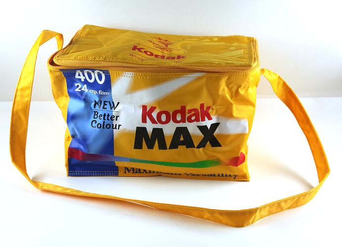 Plastic bag shaped like film box, with strap.