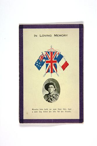 Front of card with portrait photo and coloured flags.