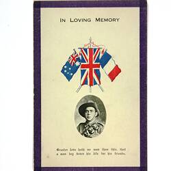 Front of card with portrait photo and coloured flags.