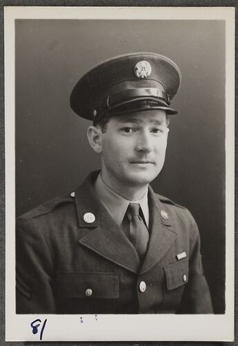 Studio portrait of man in military uniform.