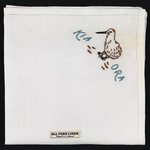 Folded handkerchief with embroidered kiwi bird.