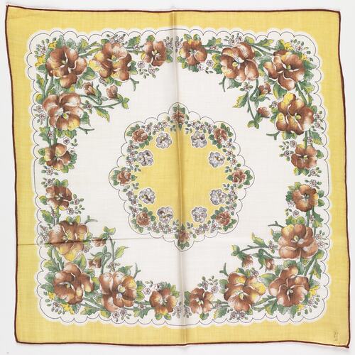 Cotton handkerchief with printed brown pansies.