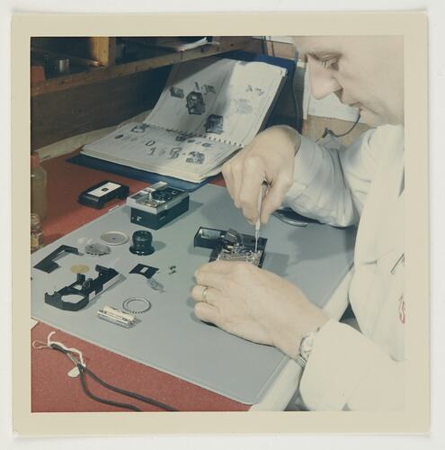 Slide 216, 'Extra Prints of Coburg Lecture', Worker With Disassembled Camera, Kodak Factory, Coburg, circa 1960s