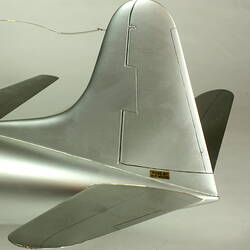 Silver model aeroplane. Tail detail.
