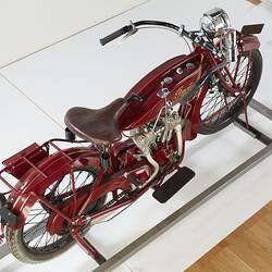 Red motor cycle, top rear view.