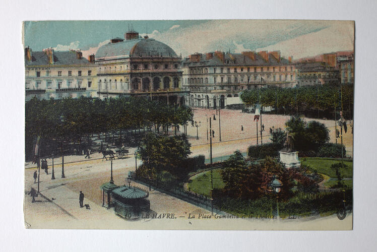 Urban streetscape with buildings and park.