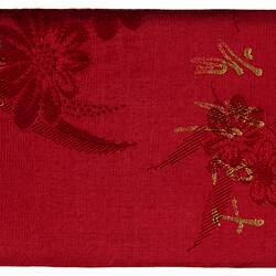 Red silk pouch or case with gold characters.