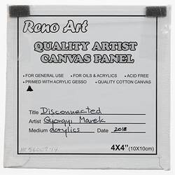 Label on back of white canvas with printed and handwritten text.