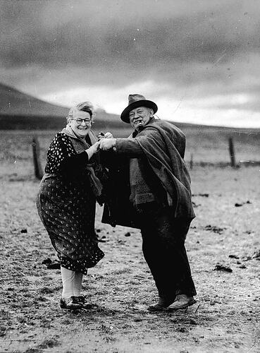 [Mr and Mrs Smith celebrating the end of the drought at Mount Fraser Homestead, near Beveridge, about 1931.]