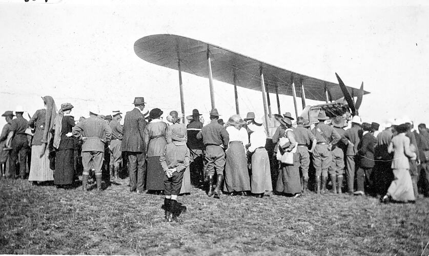[A crowd around a Harry Hawker aircraft, Broadmeadows, 1914. Hawker was a Melbourne car mechanic who became famous in England as an aviator, aircraft designer and builder.]