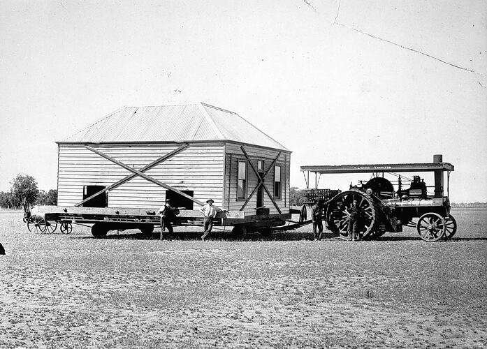 [A steam traction engine moving a house about ten miles out of St Arnaud, 1909.]