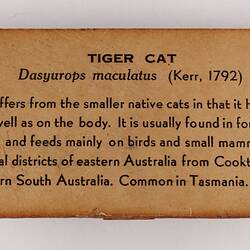 Rectangular brown label with black text.