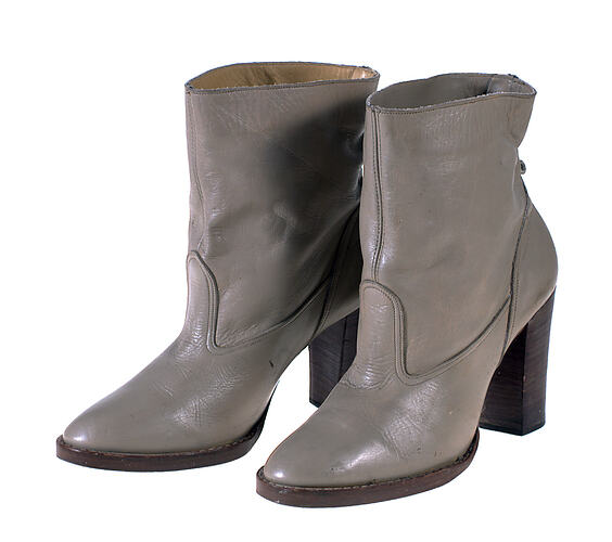 A pair of dark grey leather boots.