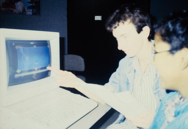 Two students working with a computer.