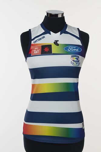 Women's AFLW guernsey with horizontal navy, white and rainbow stripes.