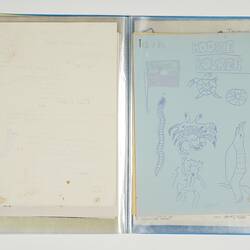 Open blue folder. Blank white page on left. Blue right page has drawings.