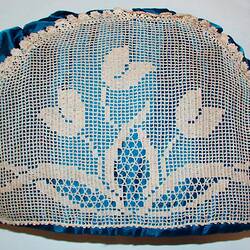 Side view of crochet lace tea cosy.